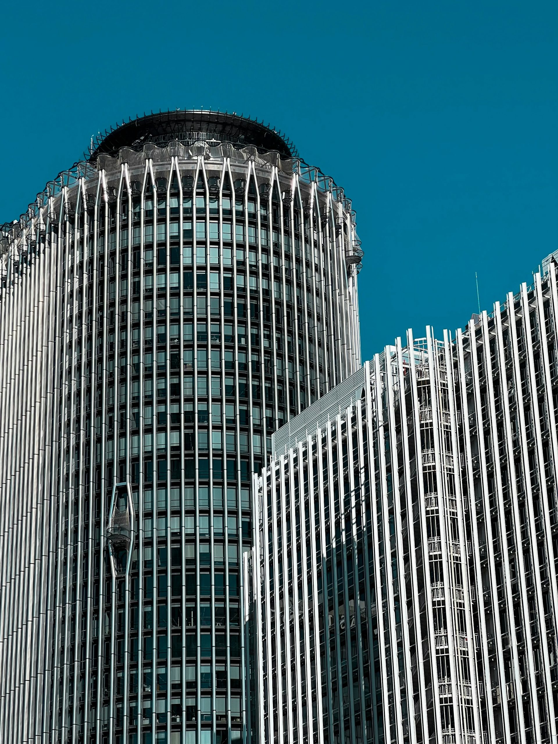 a very tall building with a clock on it's side